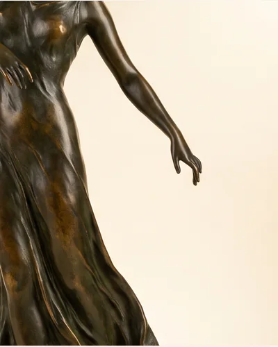 A bronze maquette for a standing figure with a dark brown patina on a slate base. — the patina.