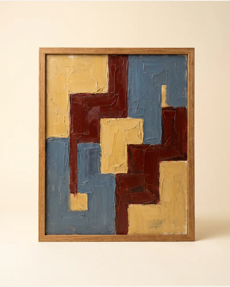 A mid-century abstract oil painting in ochre, oxblood and slate in a plain oak frame, on a paper plate.