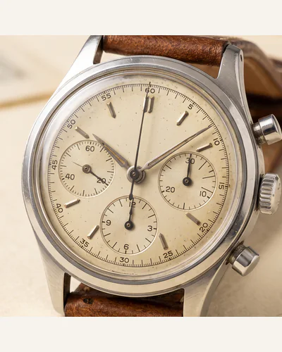 A silver-cased pocket chronometer with a subsidiary seconds dial. — the case.